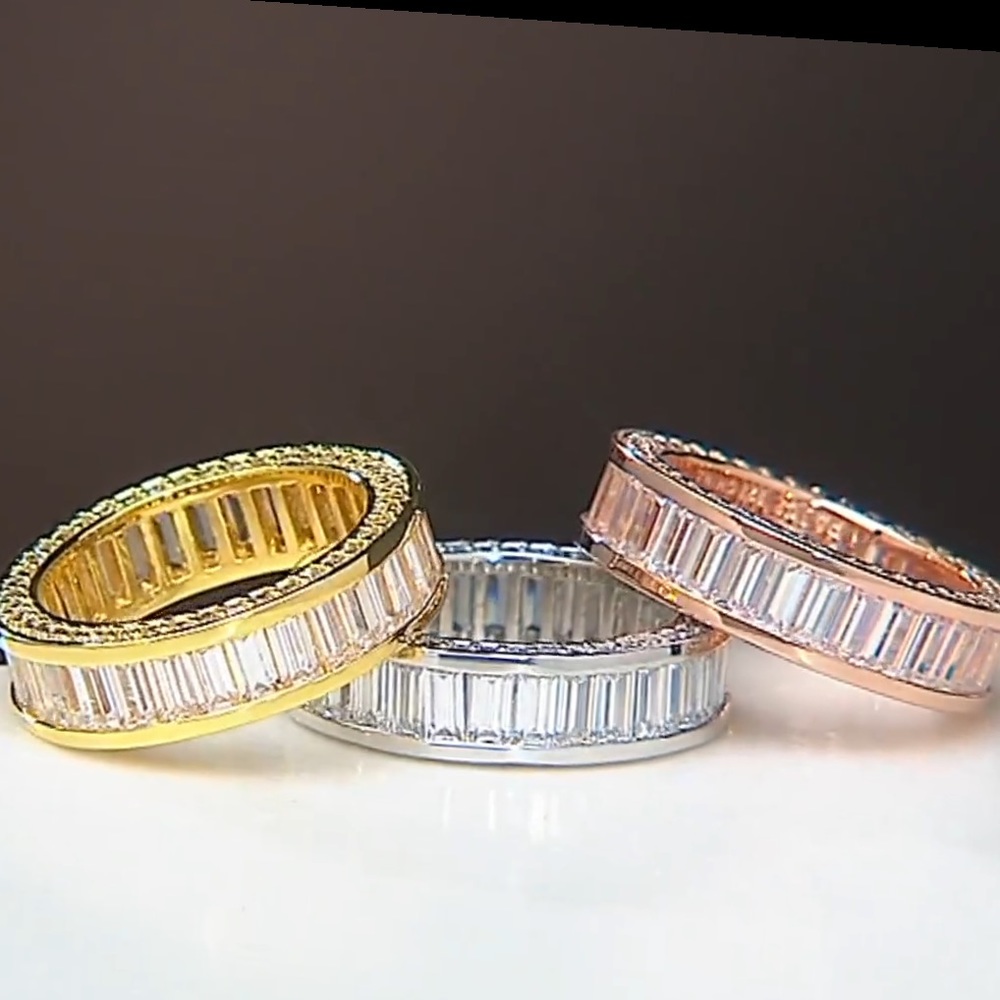 QVC Diamonique Rhodium Clad-Silver Eternity Baguette band w/round side stones.